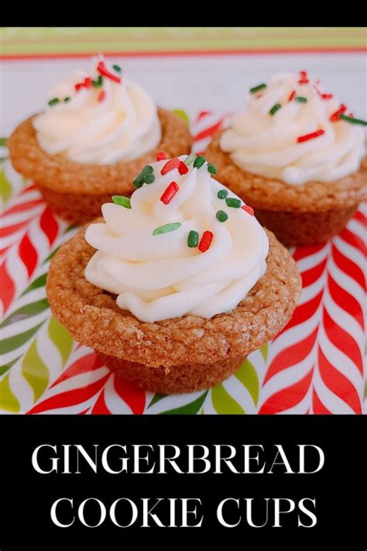Gingerbread cookie cups in a muffin pan.